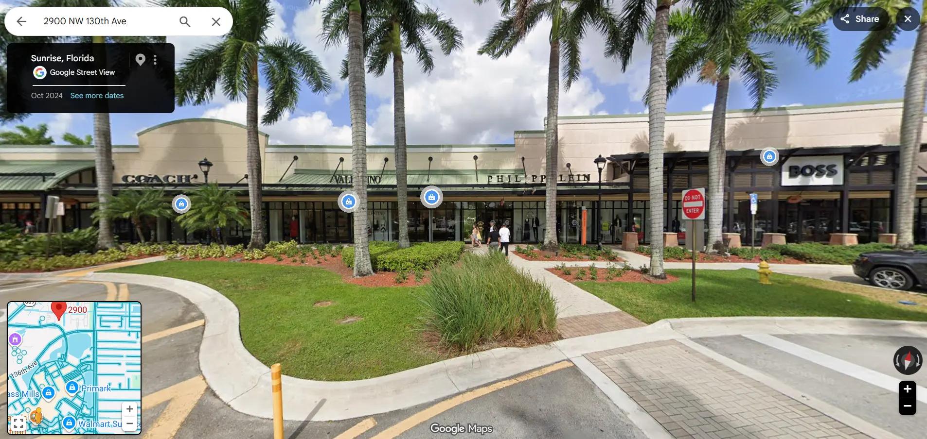 Street-level view of nearby premium shopping near the community