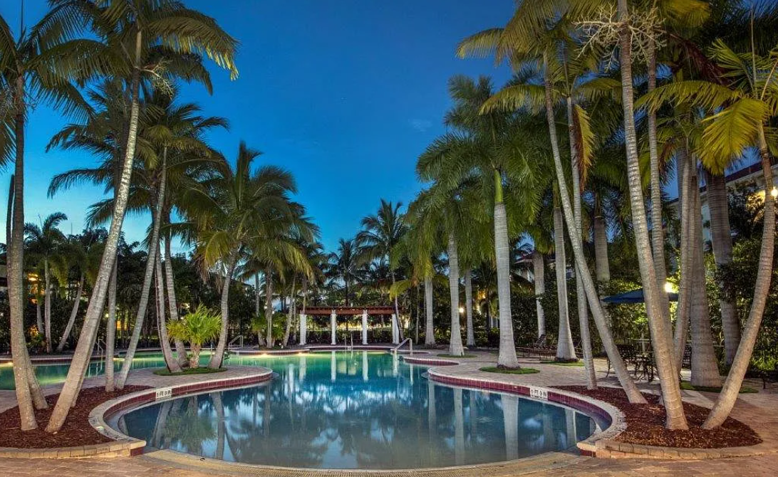 Resort-style community pool at dusk used in repositioned marketing